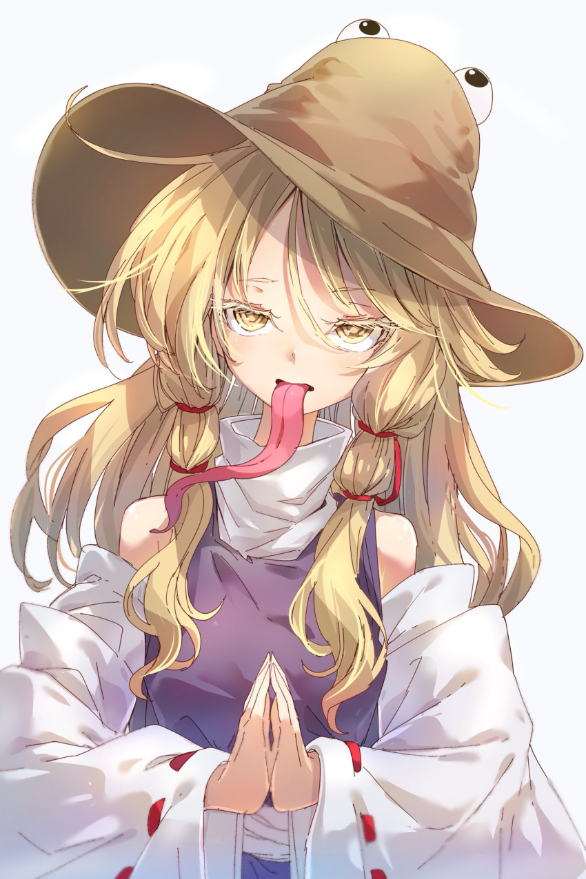 1girl bangs bare_shoulders blonde_hair brown_headwear commentary_request darjeeling_(reley) detached_sleeves eyebrows_visible_through_hair grey_background hair_between_eyes hair_ribbon highres long_hair long_sleeves long_tongue looking_at_viewer moriya_suwako own_hands_together palms_together purple_skirt purple_vest red_ribbon ribbon sidelocks simple_background skirt skirt_set solo tongue tongue_out touhou upper_body vest wide_sleeves yellow_eyes