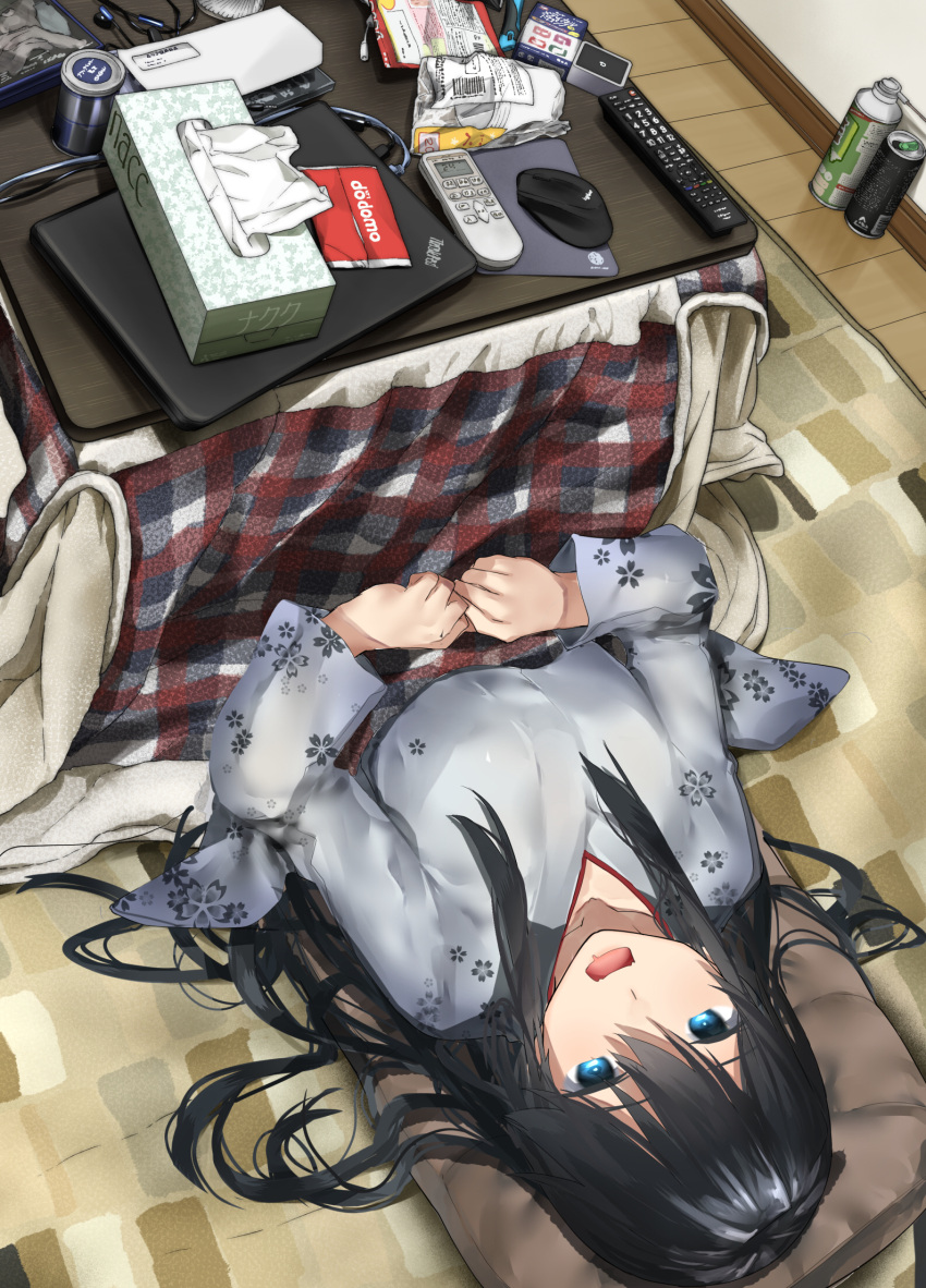 1girl araido_kagiri black_hair blue_eyes can clutter commentary_request computer controller dvd_case envelope eyebrows_visible_through_hair floral_print hair_between_eyes headphones highres japanese_clothes kimono kotatsu laptop long_hair looking_up lying messy_hair mouse_(computer) on_floor original pillow remote_control saliva soda_can solo table tissue_box under_kotatsu under_table wire yuki_onna