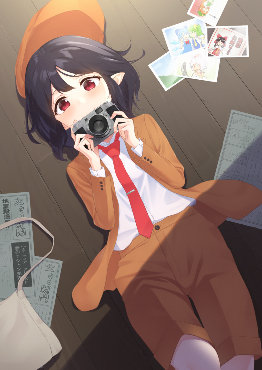 1girl arms_up bag black_hair blush brown_coat brown_shorts bunbunmaru camera cirno coat covering_mouth daiyousei flat_cap hakurei_reimu hat hat_removed headwear_removed highres holding holding_camera hong_meiling inubashiri_momiji kanpa_(campagne_9) knife komano_aun long_sleeves looking_at_viewer loose_necktie lying necktie newspaper on_back on_floor open_clothes open_coat photo_(object) pointy_ears red_eyes red_neckwear satchel shameimaru_aya shirt short_hair shorts single-lens_reflex_camera smile solo tie_clip touhou white_shirt wooden_floor
