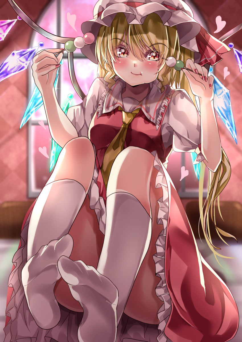 1girl absurdres blonde_hair blurry blurry_background blush closed_mouth collared_shirt commentary_request crystal dango dress eating eyebrows_visible_through_hair flandre_scarlet food frilled_dress frilled_shirt_collar frilled_skirt frills full_body hair_between_eyes hat hat_ribbon heart highres indoors kneehighs looking_at_viewer maboroshi_mochi mob_cap no_shoes puffy_short_sleeves puffy_sleeves red_dress red_ribbon red_skirt red_vest ribbon shirt short_sleeves sitting skirt skirt_set smile solo touhou vest wagashi white_headwear white_legwear white_shirt wings yellow_eyes