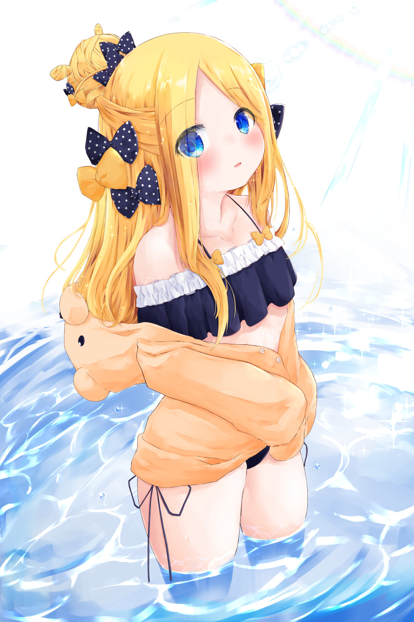 1girl abigail_williams_(fate/grand_order) absurdres bangs bikini black_bikini black_bow blonde_hair blue_eyes blush bow commentary_request damenah1t0 eyebrows_visible_through_hair fate/grand_order fate_(series) hair_bow hair_bun highres hood hood_down hoodie long_hair long_sleeves looking_at_viewer orange_bow parted_bangs polka_dot polka_dot_bow sleeves_past_wrists solo swimsuit very_long_hair water