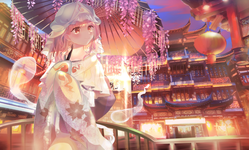 1girl architecture bangs blue_headwear blue_kimono blue_sky clouds commentary east_asian_architecture floral_print flower glint hakugyokurou hat head_tilt highres hitodama holding holding_umbrella japanese_clothes kimono lantern looking_to_the_side mob_cap obi omodaka_romu oriental_umbrella outdoors pink_eyes pink_hair railing saigyouji_yuyuko sash scenery short_hair sky sleeves_past_fingers sleeves_past_wrists smile solo standing symbol_commentary touhou triangular_headpiece twilight umbrella wisteria