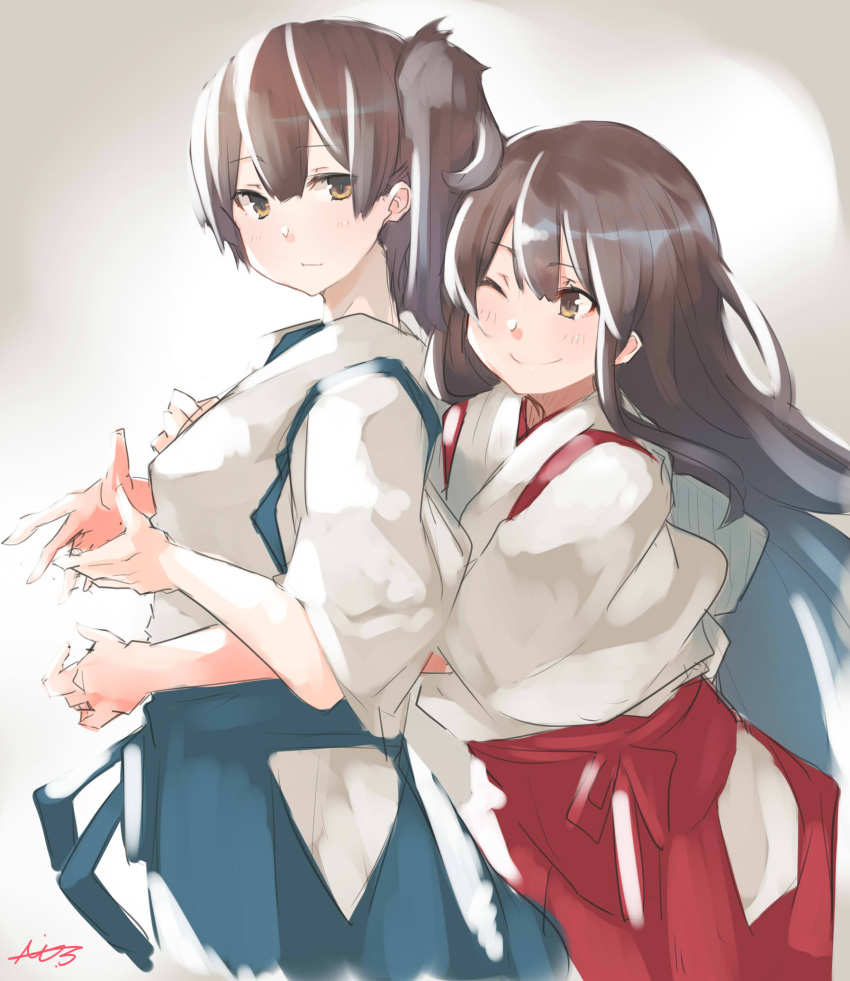 2girls akagi_(kantai_collection) akicosmossakasa blue_hakama brown_eyes brown_hair cowboy_shot gradient gradient_background grey_background hakama hakama_skirt highres hug hug_from_behind japanese_clothes kaga_(kantai_collection) kantai_collection long_hair multiple_girls one_eye_closed red_hakama side_ponytail signature tasuki