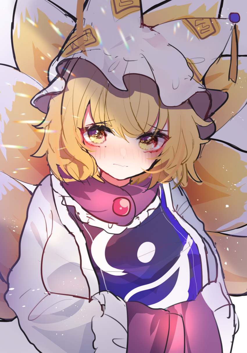 1girl animal_ears bangs blonde_hair blush breasts chikuwa_(tikuwaumai_) commentary_request dress eyebrows_visible_through_hair fox_ears fox_tail frills hands_in_opposite_sleeves hat highres large_breasts light_particles long_sleeves looking_at_viewer multiple_tails pillow_hat rainbow short_hair solo tabard tail tassel touhou upper_body white_background white_dress yakumo_ran yellow_eyes