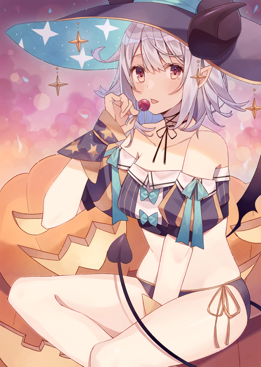 1girl bare_shoulders between_legs black_headwear black_panties black_shirt breasts collarbone commentary_request crop_top curled_horns demon_tail detached_sleeves halloween hand_up hat highres holding_lollipop jack-o'-lantern looking_at_viewer medium_breasts midriff minasenagi mini_wings no_pants original panties pointy_ears puffy_short_sleeves puffy_sleeves pumpkin red_eyes shirt short_hair short_sleeves side-tie_panties sidelocks silver_hair sitting solo stomach tail thighs tongue tongue_out underwear witch witch_hat