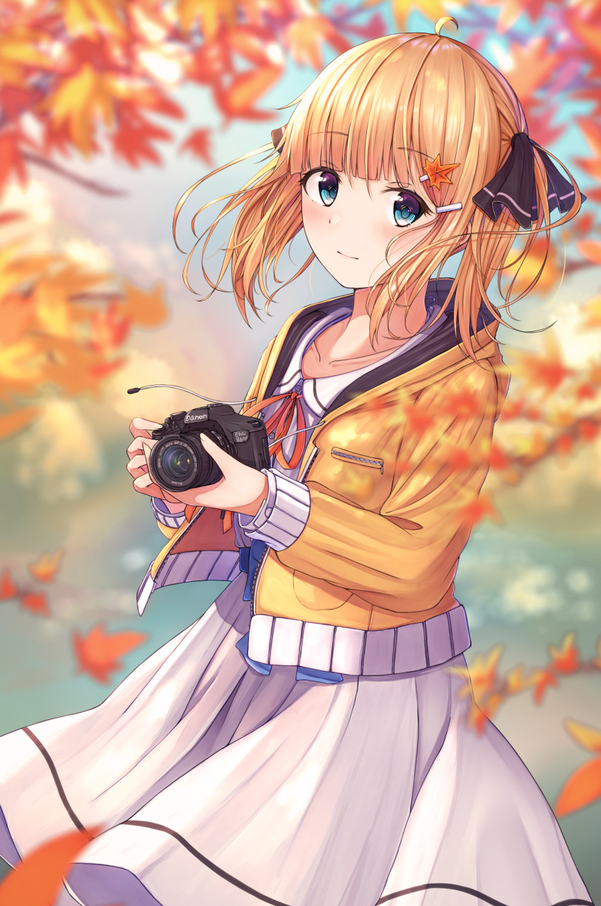 1girl ahoge autumn autumn_leaves bangs black_ribbon blonde_hair blue_eyes blunt_bangs blurry blurry_background blush brand_name_imitation camera closed_mouth cowboy_shot day depth_of_field drawstring dress eyebrows_visible_through_hair falling_leaves hair_ornament hair_ribbon hairclip highres holding holding_camera hood hood_down hooded_jacket jacket leaf leaf_hair_ornament long_hair long_sleeves looking_at_viewer n2_(yf33) open_clothes open_jacket original outdoors ribbon smile solo white_dress yellow_jacket