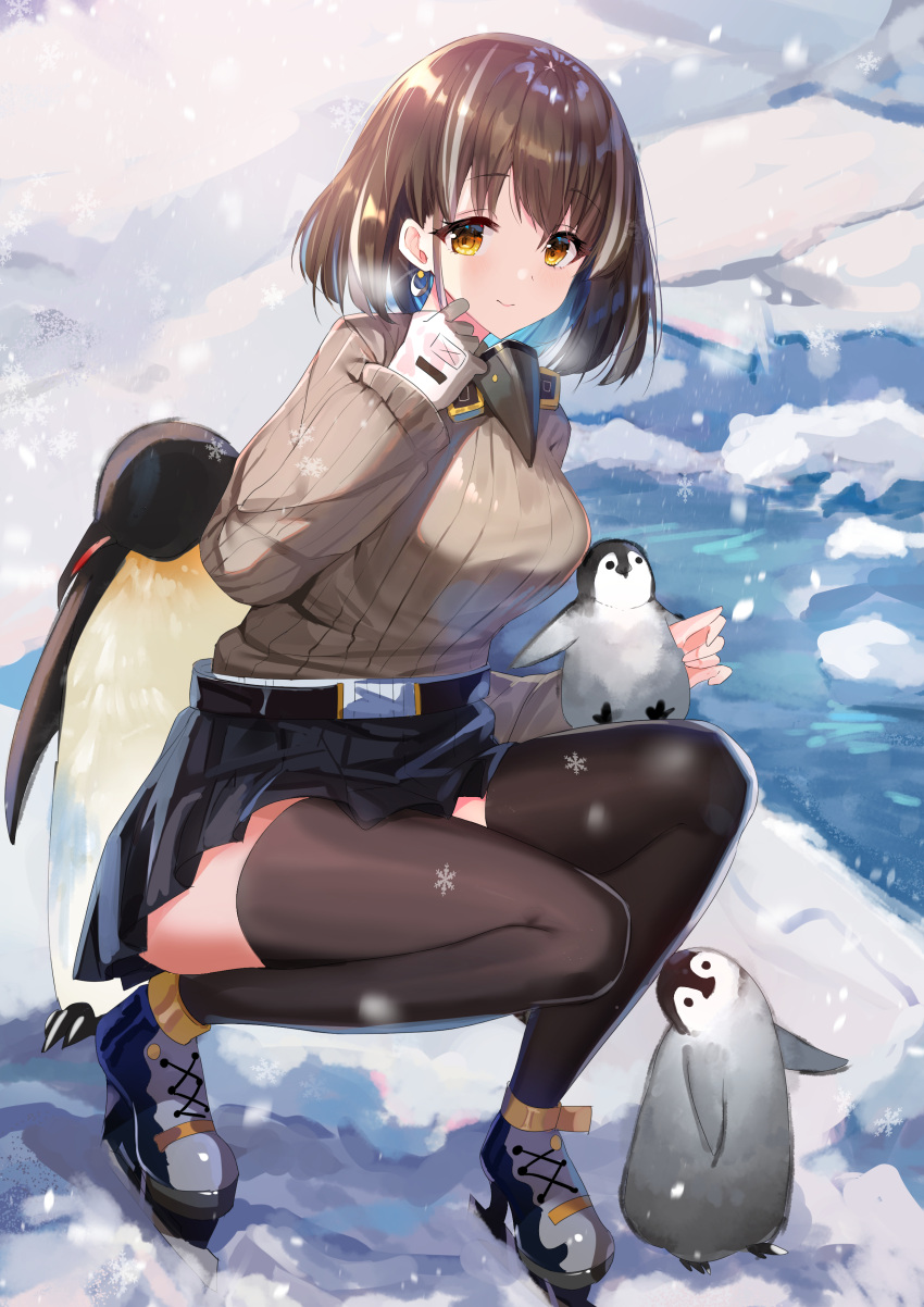 1girl absurdres animal arknights belt belt_buckle bird black_belt black_skirt blue_hair breasts brown_eyes brown_hair brown_legwear brown_sweater buckle closed_mouth commentary_request crescent crescent_earrings earrings full_body gejigejier gloves grey_footwear hand_up highres ice_skates jewelry long_sleeves magallan_(arknights) medium_breasts multicolored_hair penguin pleated_skirt ribbed_sweater skates skirt sleeves_past_wrists smile snow snowflakes snowing solo squatting sweater thigh-highs two-tone_hair water white_gloves