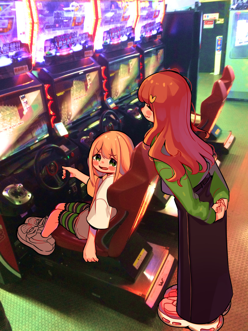 2girls :3 absurdres arcade arcade_cabinet arm_at_side arms_behind_back bangs black_skirt blonde_hair blush_stickers casual closed_eyes dot_nose furrowed_eyebrows futaba_anzu green_eyes green_shorts green_sweater hair_ornament heart heart_hair_ornament high-waist_skirt highres idolmaster idolmaster_cinderella_girls indoors leaning_forward long_hair long_skirt long_sleeves looking_at_another low_twintails more_e_4km moroboshi_kirari multiple_girls open_mouth orange_hair oversized_clothes photo_background shirt shoes shorts sitting skirt sneakers standing steering_wheel striped striped_shorts sweater tareme twintails wavy_hair white_footwear white_shirt