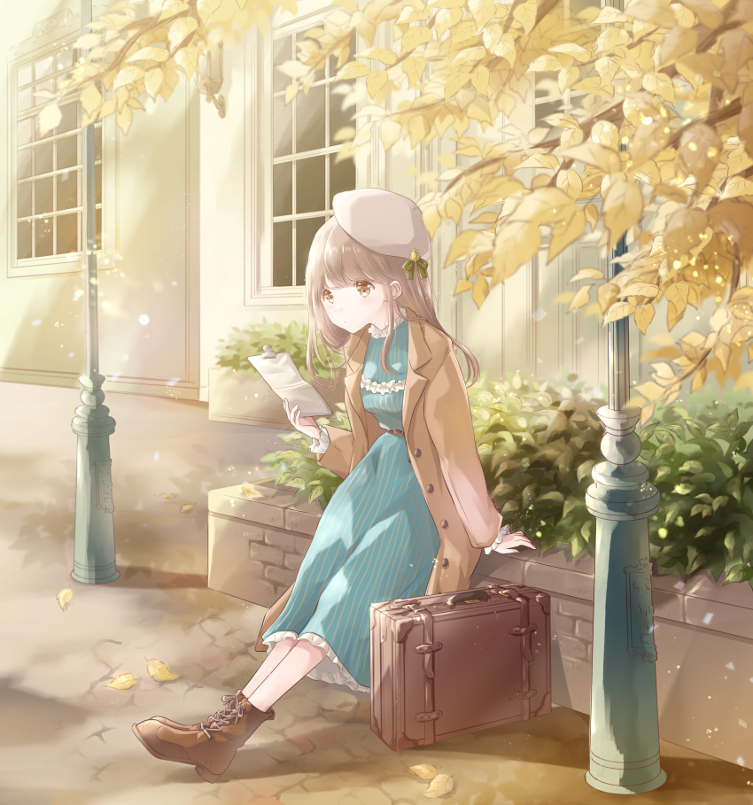 1girl autumn autumn_leaves bangs beret blue_dress boots brick_wall brown_coat brown_eyes brown_footwear building coat cobblestone commentary_request cross-laced_footwear day dress expressionless eyebrows_visible_through_hair french_commentary hat hedge_(plant) highres holding holding_paper hoshiibara_mato lamppost light_brown_hair light_particles long_hair looking_to_the_side open_clothes open_coat original outdoors outstretched_legs paper petticoat sitting solo striped suitcase tree_branch vertical-striped_dress vertical_stripes white_headwear window