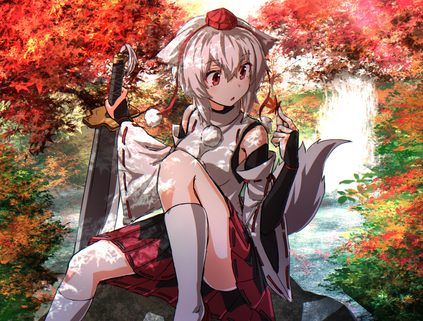 1girl animal_ears autumn_leaves bare_shoulders black_skirt bridal_gauntlets dappled_sunlight day detached_sleeves eyebrows_visible_through_hair feet_out_of_frame greatsword hair_between_eyes hands_up hat highres holding holding_leaf holding_sword holding_weapon inubashiri_momiji kakutasu_(akihiron_cactus) knee_up leaf looking_to_the_side maple_leaf medium_skirt multicolored multicolored_clothes multicolored_skirt outdoors parted_lips planted_sword planted_weapon pom_pom_(clothes) red_eyes red_skirt ribbon-trimmed_sleeves ribbon_trim river shade shirt short_hair sitting skirt sleeveless sleeveless_shirt socks solo sunlight sword tail tokin_hat touhou tree water waterfall weapon white_hair white_legwear white_shirt wolf_ears wolf_tail