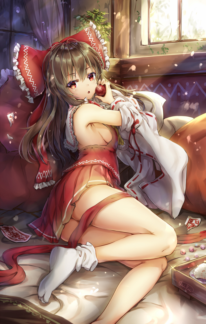 1girl :o apple armpits bangs bare_legs bare_shoulders bed_sheet bow breasts brown_hair cushion day detached_sleeves eyebrows_visible_through_hair fii_fii_(feefeeowo) food frilled_bow frilled_shirt_collar frills from_behind fruit hair_bow hakurei_reimu highres holding holding_food holding_fruit indoors large_bow long_hair long_sleeves looking_at_viewer looking_back lying marble medium_hair miniskirt ofuda on_bed on_side parted_lips pleated_skirt red_bow red_eyes red_ribbon red_skirt ribbon ribbon-trimmed_sleeves ribbon_trim sideboob skirt socks solo sparkle sunlight touhou white_legwear window