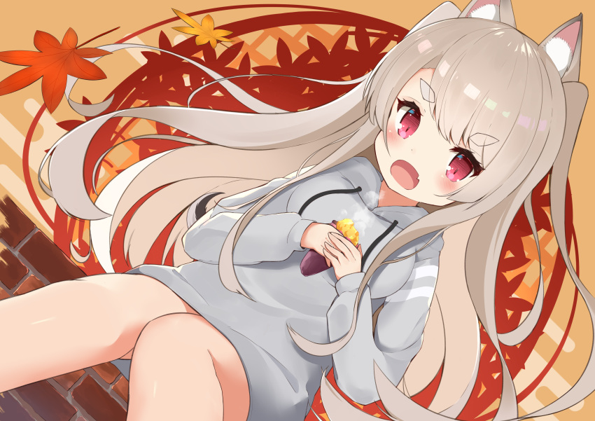 1girl absurdres animal_ear_fluff animal_ears autumn autumn_leaves azur_lane bangs bare_legs blush breasts brick_wall commentary_request dog_ears drawstring eyebrows_visible_through_hair fang feet_out_of_frame food grey_hair highres holding holding_food large_breasts long_hair long_sleeves looking_at_viewer open_mouth orange_background red_eyes short_eyebrows sidelocks sitting skin_fang solo sweatshirt sweet_potato swept_bangs thick_eyebrows two_side_up yomogi_uehara yuudachi_(azur_lane)