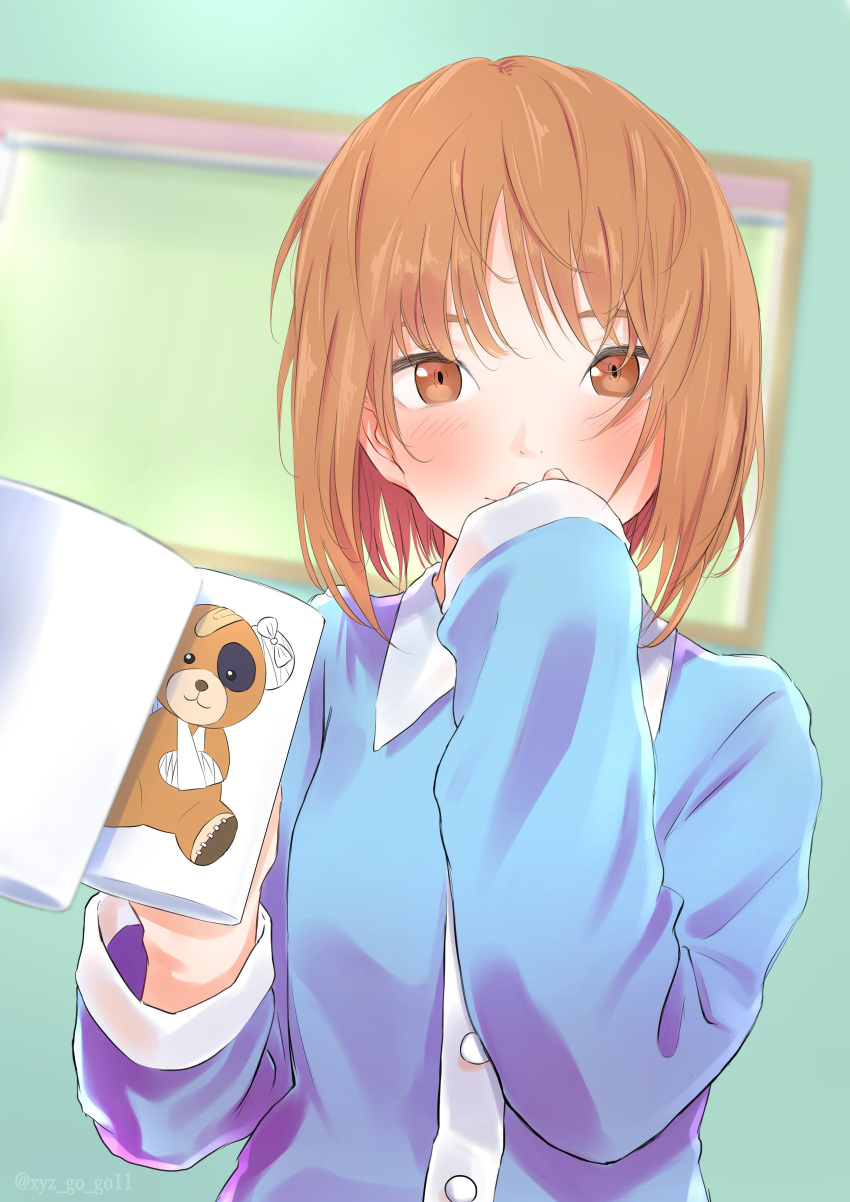 1girl absurdres animal_print bandages bandaid bangs bear_print blue_shirt blurry blurry_background blush boko_(girls_und_panzer) brown_eyes brown_hair closed_mouth collared_shirt commentary covering_mouth cup depth_of_field girls_und_panzer highres holding holding_cup long_sleeves looking_at_viewer mug nishizumi_miho oze_(xyz_go_go11) pajamas print_mug reflection shirt short_hair smile solo stuffed_animal stuffed_toy teddy_bear upper_body