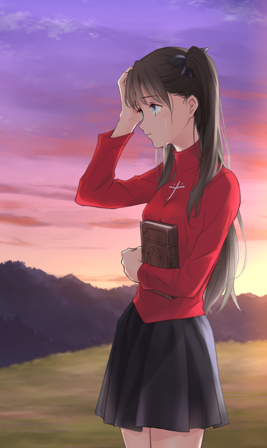 1girl akizuki565602 black_ribbon black_skirt book brown_hair casual crying fate/stay_night fate_(series) green_eyes hand_in_hair highres long_hair magic_circle ribbon skirt solo sunset toosaka_rin turtleneck twintails type-moon