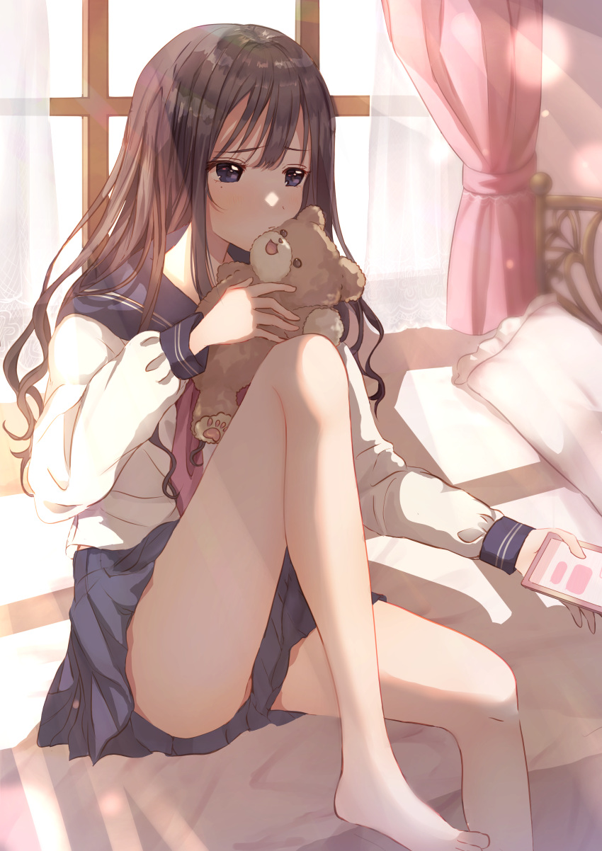 1girl absurdres bangs bare_legs bed blue_eyes blue_skirt blush brown_hair closed_mouth curtains eyebrows_visible_through_hair feet_out_of_frame hair_between_eyes highres holding holding_phone indoors knee_up long_hair long_sleeves mole mole_under_eye neckerchief on_bed original peach_punch phone pleated_skirt red_neckwear sailor_collar school_uniform serafuku shirt sitting sitting_on_bed skirt solo stuffed_animal stuffed_toy teddy_bear wavy_hair white_shirt window