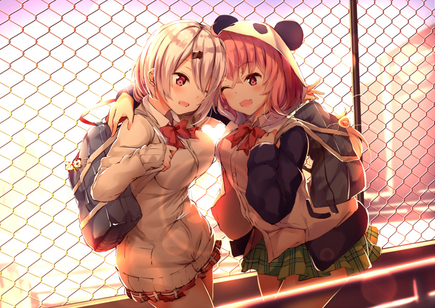 2girls ;d ahoge animal_ears arm_around_neck arm_around_shoulder bag bag_charm bangs blurry blurry_background blush bow bowtie breasts brown_hair cardigan chain-link_fence charm_(object) collared_shirt commentary_request depth_of_field dress_shirt earrings eye_contact eyebrows_visible_through_hair fake_animal_ears fang fence green_skirt grey_cardigan hair_between_eyes hood hood_up hooded_jacket jacket jewelry long_sleeves looking_at_another medium_breasts multiple_girls nijisanji one_eye_closed open_mouth outdoors panda_ears panda_hood plaid plaid_skirt pleated_skirt red_eyes red_neckwear red_skirt sasaki_saku school_bag shiina_yuika shirt silver_hair skirt sleeves_past_wrists smile sunset virtual_youtuber white_jacket white_shirt yukishiro_arute