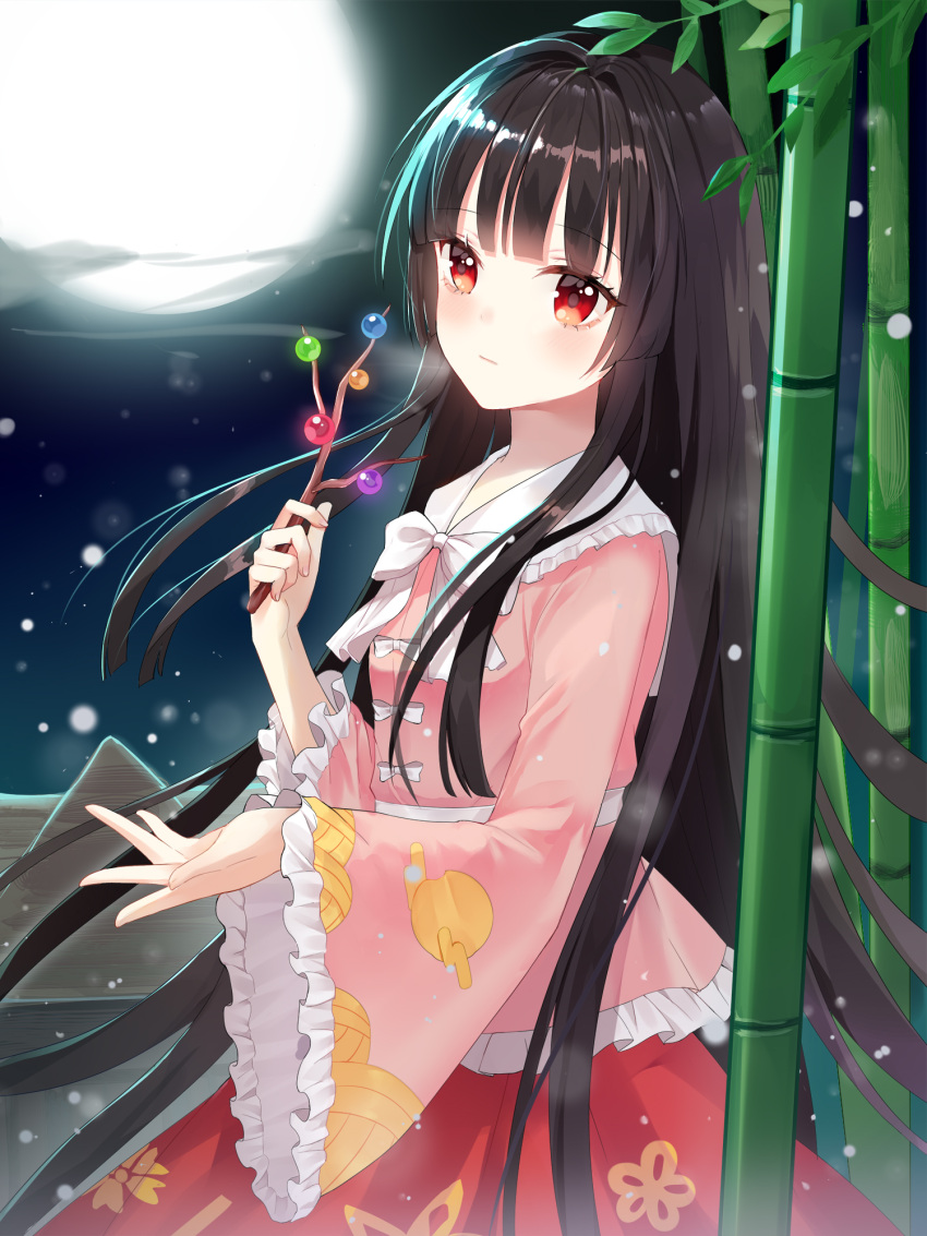 1girl bamboo black_hair bow branch closed_mouth commentary_request frilled_shirt frilled_shirt_collar frills full_moon highres holding houraisan_kaguya hum_(ten_ten) jeweled_branch_of_hourai long_hair long_sleeves looking_at_viewer moon night pink_shirt red_eyes red_skirt shirt skirt solo touhou very_long_hair white_bow wide_sleeves