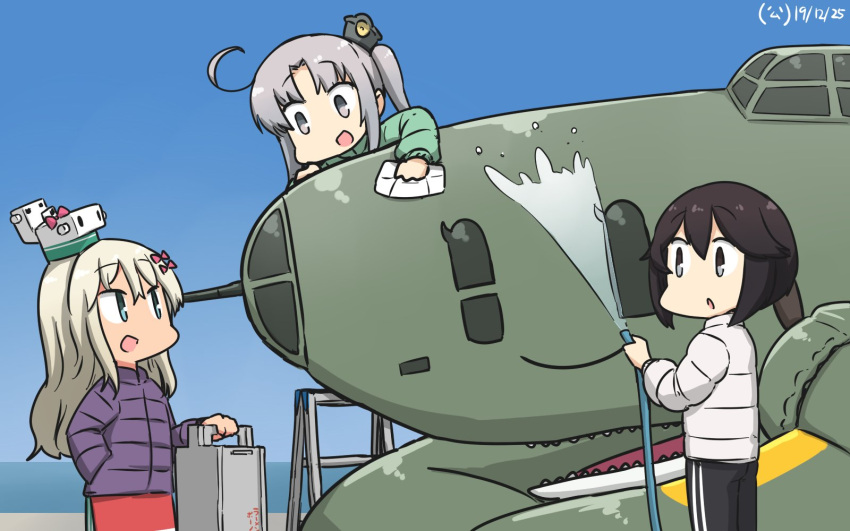 3girls akitsushima_(kantai_collection) black_hair blonde_hair blue_eyes blush bow coat dated eyebrows_visible_through_hair gradient_sky grecale_(kantai_collection) grey_eyes grey_hair hair_between_eyes hair_bow hair_ornament hair_ribbon hamu_koutarou hayasui_(kantai_collection) highres kantai_collection long_hair long_sleeves looking_at_viewer multiple_girls nishikitaitei-chan open_mouth pants ribbon short_hair side_ponytail sidelocks sky smile track_pants water winter_clothes winter_coat