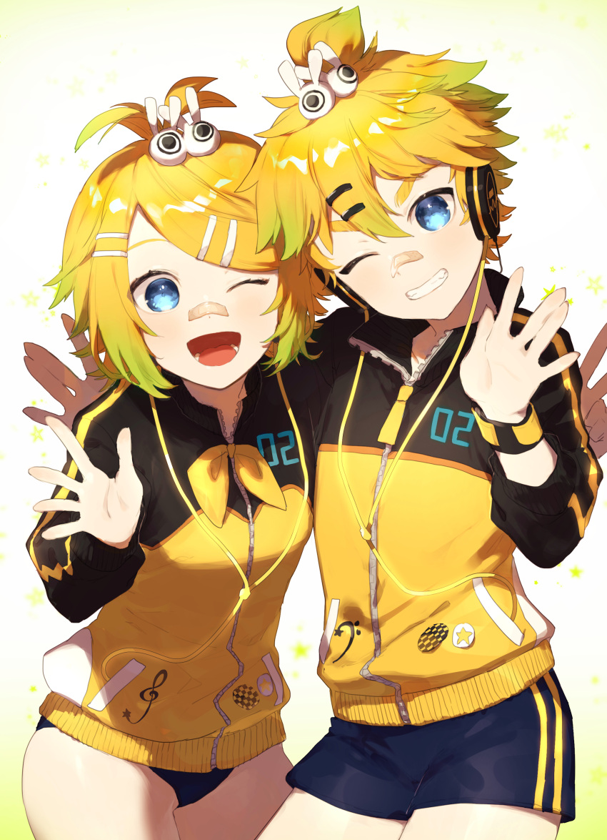 absurdres arm_around_back badge bandage_on_face bangs bass_clef blonde_hair blue_eyes bow buruma cable commentary cowboy_shot grin hair_bow hair_ornament hairclip hand_up head_tilt headphones highres jacket kagamine_len kagamine_rin leaning_forward looking_at_viewer matching_outfit neckerchief one_eye_closed open_mouth project_diva_(series) short_hair short_ponytail short_shorts shorts side-by-side smile spiky_hair sportswear star stylish_energy_(module) swept_bangs track_jacket treble_clef two-tone_jacket v vocaloid waving white_bow wristband yamada_ichi yellow_jacket yellow_neckwear zipper zipper_pull_tab