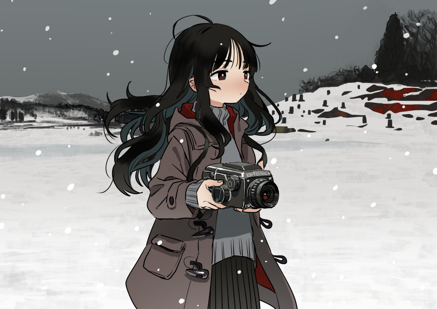 1girl absurdres black_hair brown_coat camera coat cowboy_shot floating_hair highres hill holding holding_camera long_hair original outdoors product_placement red_eyes scenery snow snowing solo sweater tree turtleneck turtleneck_sweater winter winter_clothes zinbei