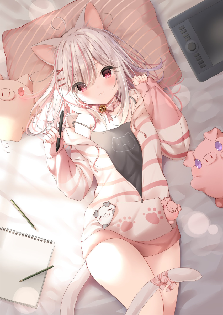 1girl ahoge animal_ears bangs bed_sheet black_camisole blush bow camisole cat_ears cat_girl cat_tail closed_mouth commentary_request drawing_tablet drawstring eyebrows_visible_through_hair eyes_visible_through_hair hair_ornament hair_over_one_eye hairclip hands_up highres holding holding_stylus hood hood_down hooded_jacket jacket long_sleeves looking_at_viewer lying mafuyu_(chibi21) multicolored_hair notepad on_back open_clothes open_jacket original pen pillow pinching_sleeves pink_bow red_eyes redhead sleeves_past_wrists smile solo strap_slip streaked_hair striped_jacket stuffed_animal stuffed_pig stuffed_toy stylus tail tail_bow x_hair_ornament