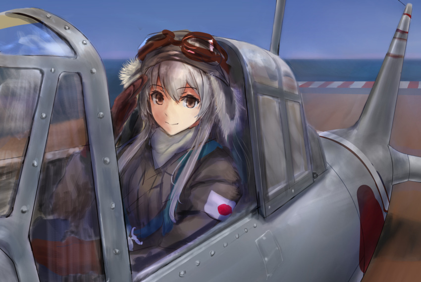 1girl aircraft aircraft_request alternate_costume aviator_cap bangs brown_eyes brown_gloves day eyebrows_visible_through_hair fur gloves goggles goggles_on_headwear hair_between_eyes haruto_(harut_n) hat highres jacket kantai_collection long_hair long_sleeves ocean outdoors salute shoukaku_(kantai_collection) sidelocks sky smile solo white_hair