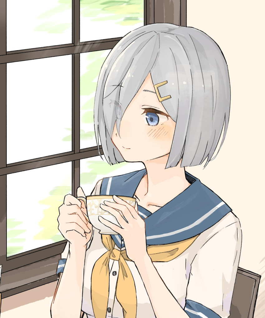 1girl bangs blue_eyes blue_sailor_collar blush breasts chair cup eyebrows_visible_through_hair hair_ornament hair_over_one_eye hairclip hamakaze_(kantai_collection) highres hinata_hibari holding holding_cup kantai_collection neckerchief sailor_collar school_uniform serafuku short_hair silver_hair smile solo teacup window yellow_neckwear