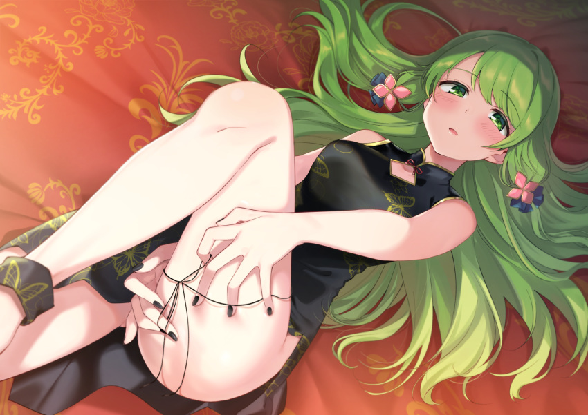 1girl ass_visible_through_thighs bangs black_dress black_nails blurry blush breasts china_dress chinese_clothes commentary depth_of_field dress feet_out_of_frame green_eyes green_hair hair_ornament highres long_hair looking_at_viewer lying medium_breasts morinaka_kazaki nail_polish nijisanji on_back on_bed open_mouth parted_lips sleeveless solo string thighs virtual_youtuber yuama_(drop)