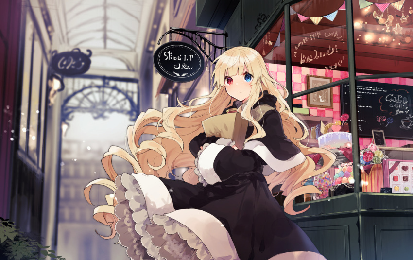 1girl bag bangs black_capelet black_dress blonde_hair blue_eyes blunt_bangs blurry blurry_background bush cake capelet chalkboard chalkboard_sign closed_mouth cookie depth_of_field dress floating_hair food frilled_dress frilled_sleeves frills grocery_bag heterochromia highres holding ikeuchi_tanuma light_blush long_hair long_sleeves looking_at_viewer original red_eyes shopping_bag sign solo standing very_long_hair wide_sleeves