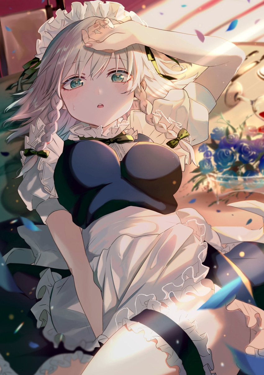 1girl apron arm_up between_legs blue_dress blue_flower blue_rose blurry blurry_background blush bow bowl braid breasts commentary_request cup dress drinking_glass fingernails flower green_bow green_eyes hair_bow hand_between_legs highres izayoi_sakuya leg_garter long_hair looking_at_viewer lying maid_apron maid_headdress medium_breasts on_back parted_lips petals puffy_short_sleeves puffy_sleeves rose rose_petals satoupote short_sleeves silver_hair solo sweat touhou twin_braids