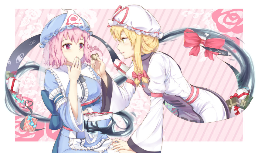 2girls arm_garter bangs blonde_hair blue_dress blue_headwear blush border bow box breasts commentary_request diagonal_stripes dress eyebrows_visible_through_hair food frilled_shirt_collar frills from_side gift gift_box hair_bow hand_up hat hat_ribbon heart highres holding holding_food juliet_sleeves leaning_forward long_sleeves looking_at_another medium_breasts multiple_girls outside_border parted_lips pink_background pink_eyes pink_hair profile puffy_sleeves red_bow red_ribbon ribbon saigyouji_yuyuko short_hair sidelocks small_breasts striped striped_background tabard touhou triangular_headpiece veil vh(yuv-achi) white_border white_dress white_headwear wide_sleeves yakumo_yukari yellow_eyes yuri