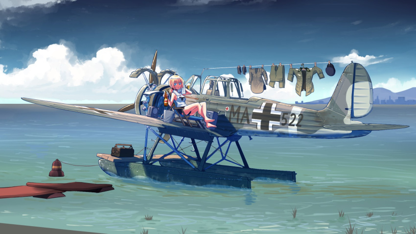 1girl aircraft airplane blonde_hair blue_eyes clouds cloudy_sky day drying drying_clothes erica_(naze1940) floating_hair hat highres holding laundry long_hair military military_uniform outdoors seaplane short_hair sky soldier solo toolbox uniform weapon world_war_ii