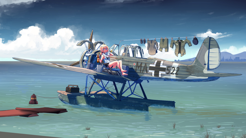 1girl aircraft airplane balkenkreuz barefoot beer_bottle black_shorts blonde_hair blue_eyes bottle bucket check_commentary clothes_pin clothes_removed clouds commentary commentary_request crossed_ankles day deck_chair drying drying_clothes erica_(naze1940) hat hat_removed headwear_removed highres holding holding_bottle horizon hot laundry looking_at_viewer low_ponytail medium_hair military military_uniform ocean original outdoors ponytail radio seaplane short_shorts shorts sitting sky sleeveless solo sunlight tank_top toolbox towel uniform vehicle_request water weapon wide_shot world_war_ii