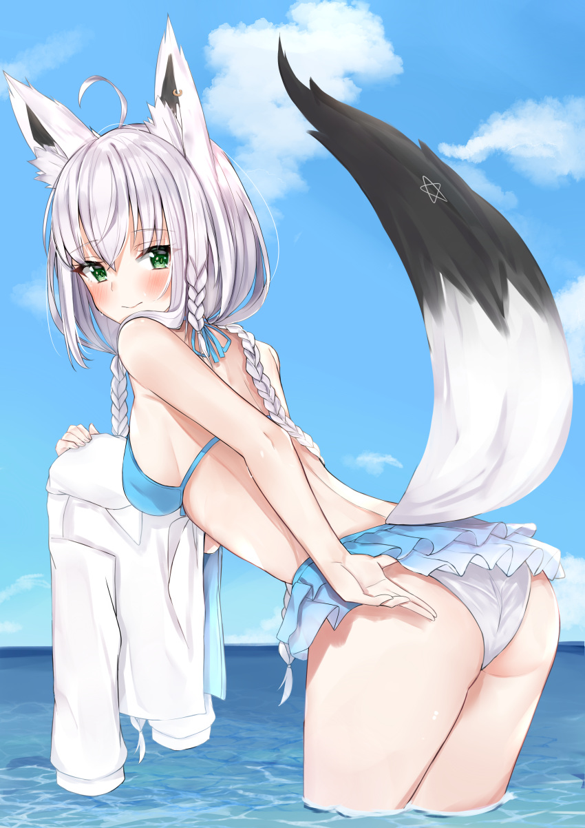 1girl absurdres ahoge animal_ears back bangs bare_arms bare_shoulders bikini bikini_skirt blue_bikini blue_sky blush braid breasts commentary_request day eyebrows_visible_through_hair fox_ears fox_girl fox_tail from_behind halterneck highres holding_shirt hololive horizon leaning_forward long_hair looking_at_viewer looking_back medium_breasts multiple_braids nemun_(tamizzz) ocean outdoors shirakami_fubuki shirt_removed short_hair sideboob silver_hair sky solo swimsuit tail very_long_hair wading water