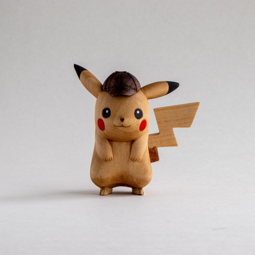 :3 absurdres black_eyes commentary commission deerstalker detective_pikachu detective_pikachu_(character) english_commentary gen_1_pokemon hat hatted_pokemon highres looking_at_viewer no_humans photo pikachu pokemon sculpture sean_syman shadow simple_background white_background