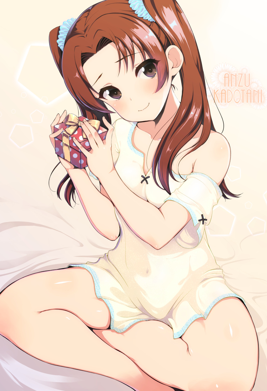 1girl 3yuki absurdres alternate_hair_ornament bangs bed_sheet blue_scrunchie brown_eyes brown_hair character_name closed_mouth commentary covered_navel gift girls_und_panzer hair_ornament hair_scrunchie highres holding holding_gift indian_style kadotani_anzu long_hair looking_at_viewer off_shoulder on_bed pajamas parted_bangs scrunchie shirt short_sleeves sitting smile solo twintails white_shirt