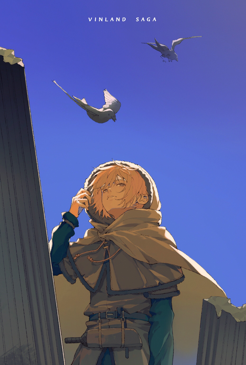 1boy absurdres belt bird blonde_hair brown_capelet cloak copyright_name dagger day highres hood hooded_cloak long_sleeves looking_up male_focus outdoors seagull sheath sheathed solo standing thorfinn vinland_saga weapon zwei_(chugokujin)