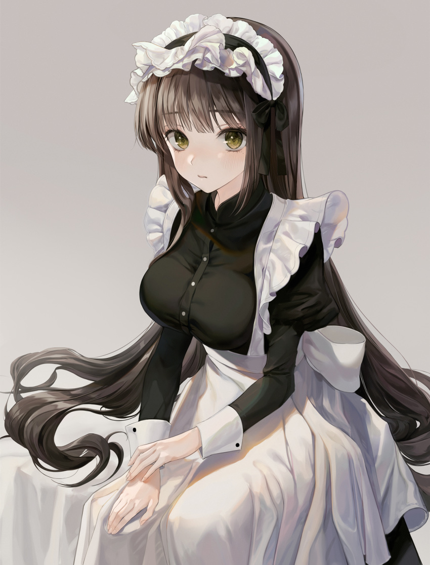 1girl apron ascot bangs black_dress blush breasts brown_hair buttons closed_mouth commentary_request dress eyebrows_visible_through_hair frilled_ascot frills green_eyes grey_background hair_ribbon highres large_breasts long_hair long_sleeves maid maid_headdress minncn original ribbon simple_background sitting solo white_apron wrist_cuffs
