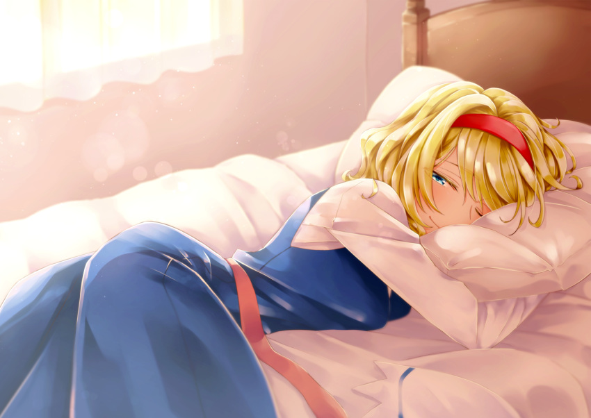 1girl alice_margatroid bed blonde_hair blue_eyes closed_mouth hairband long_sleeves looking_at_viewer lying megumiya on_bed on_stomach one_eye_closed pillow red_hairband short_hair smile solo touhou