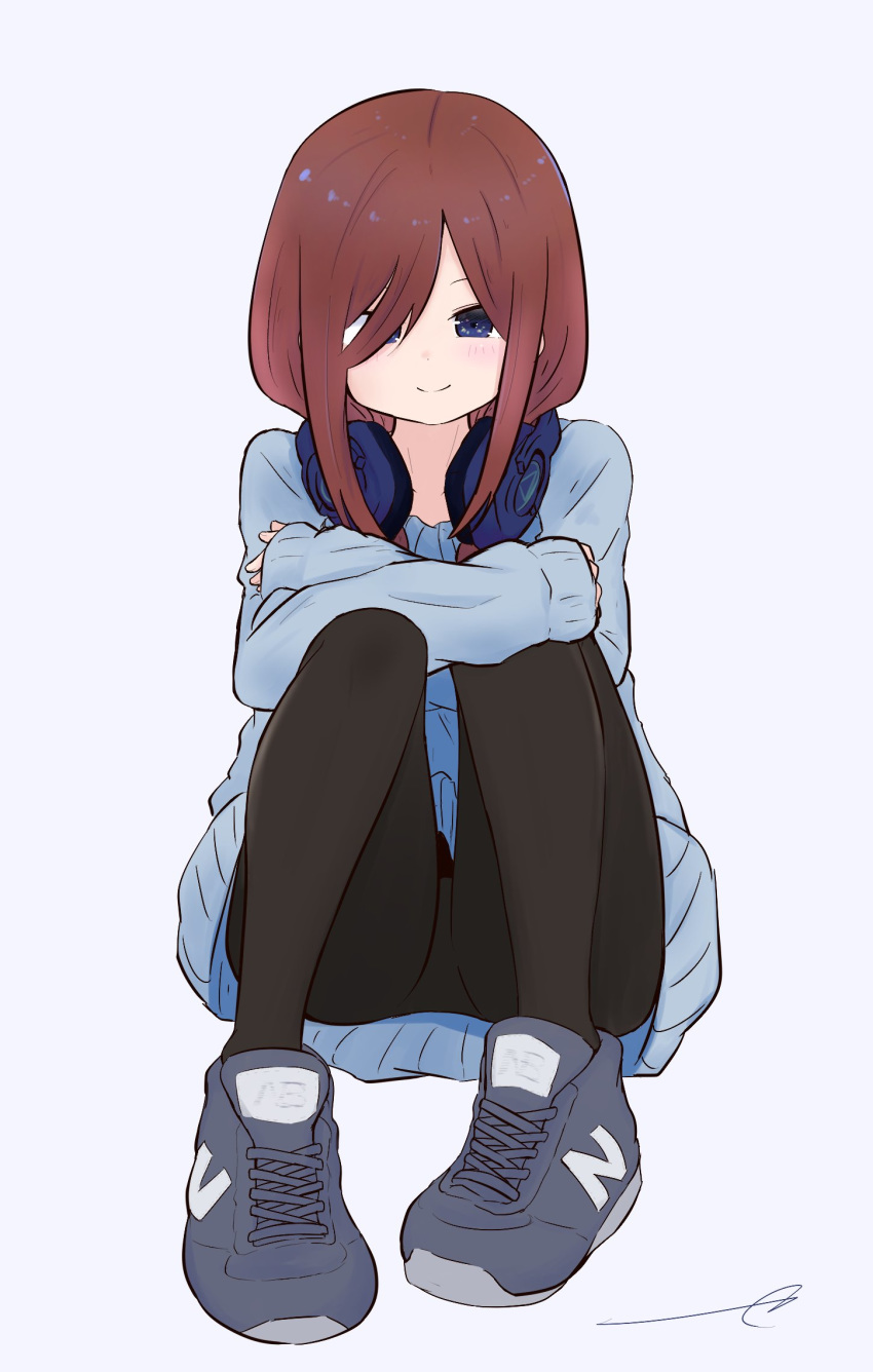 1girl bangs black_legwear blue_eyes blue_sweater blush brown_hair closed_mouth commentary_request crossed_arms eyebrows_behind_hair full_body go-toubun_no_hanayome grey_background grey_footwear hair_over_shoulder headphones headphones_around_neck highres knees_up kujou_karasuma long_hair long_sleeves looking_at_viewer nakano_miku pantyhose parted_bangs shoes signature simple_background sitting sleeves_past_wrists smile sneakers solo sweater