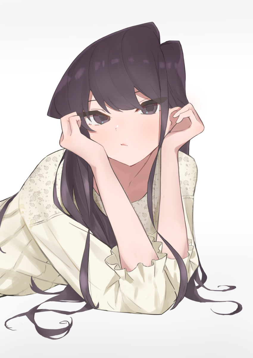 1girl asymmetrical_hair bangs black_eyes black_hair blush collarbone commentary_request eyelashes gradient gradient_background grey_background highres holding_head komi-san_wa_komyushou_desu komi_shouko leaning_forward long_hair long_sleeves lying on_stomach print_shirt shirt sidelocks simple_background solo swept_bangs takita_(takita3411) upper_body white_background