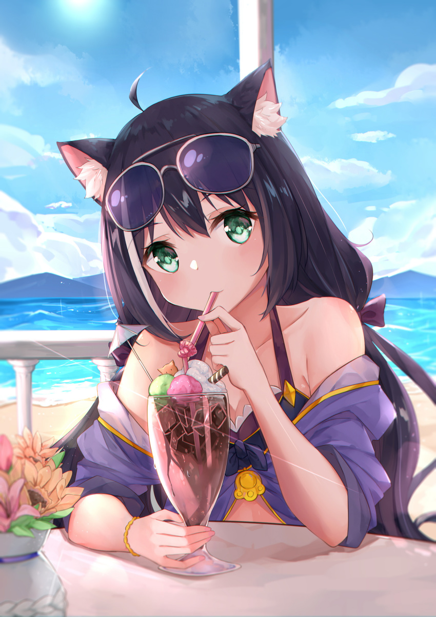 1girl absurdres ahoge animal_ear_fluff animal_ears bangs bare_shoulders beach bikini black_hair blue_sky blush bow bracelet cat_ears clouds collarbone cup day drinking_glass drinking_straw eyebrows_visible_through_hair eyewear_on_head green_eyes hair_between_eyes hair_bow hair_ribbon highres jewelry kyaru_(princess_connect) long_hair looking_at_viewer low_twintails mountain multicolored_hair ocean off_shoulder outdoors princess_connect! princess_connect!_re:dive purple_bow purple_ribbon ribbon sitting sky solo streaked_hair sunglasses swimsuit table to_naive twintails very_long_hair water white_hair