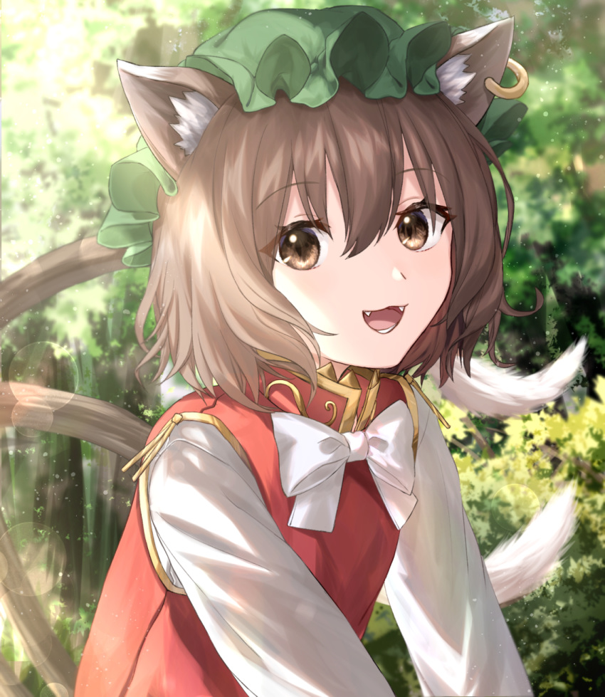 1girl :d animal_ears bangs bow bowtie brown_eyes brown_hair cat_ears cat_girl cat_tail chen day earrings eyebrows_visible_through_hair fangs green_headwear hair_between_eyes hat highres jewelry lens_flare long_sleeves looking_at_viewer mob_cap mozuno_(mozya_7) multiple_tails open_mouth outdoors red_vest shirt short_hair smile solo tail touhou tree two_tails upper_body vest white_bow white_neckwear white_shirt