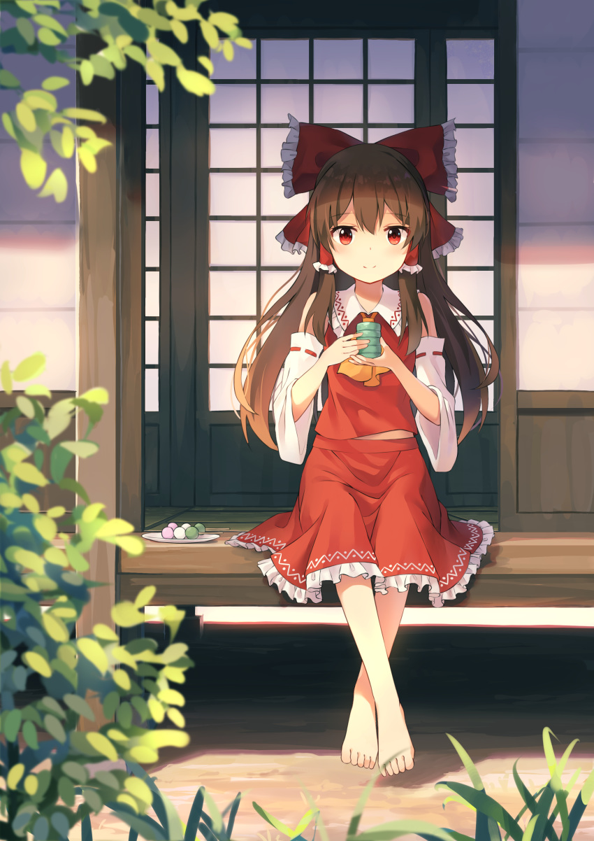 1girl absurdres ascot bangs barefoot blurry_foreground bow brown_hair closed_mouth detached_sleeves eyebrows_visible_through_hair floating_hair frilled_bow frilled_hair_tubes frilled_skirt frills hair_between_eyes hair_bow hair_tubes hakurei_reimu highres long_hair long_sleeves looking_at_viewer medium_skirt orange_neckwear outdoors red_bow red_eyes red_shirt red_skirt ribbon-trimmed_sleeves ribbon_trim shirt sitting skirt sleeveless sleeveless_shirt smile solo touhou very_long_hair white_sleeves yaruwashi