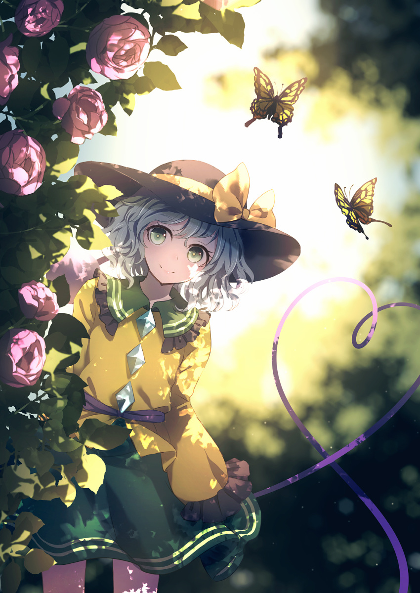 1girl backlighting black_headwear blurry blurry_background blush bow closed_mouth commentary_request day depth_of_field dise feet_out_of_frame flower frilled_shirt_collar frilled_sleeves frills green_eyes green_skirt hat hat_bow hat_ornament heart heart_of_string highres komeiji_koishi leaning_to_the_side long_sleeves looking_at_viewer outdoors pink_flower pink_rose rose shirt short_hair silver_hair skirt sleeves_past_fingers sleeves_past_wrists smile solo standing swallowtail_butterfly touhou yellow_bow yellow_shirt