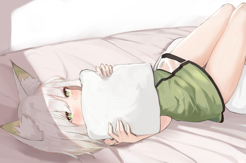 1girl animal_ear_fluff animal_ears arknights bangs bare_arms bare_shoulders bed blush dress green_dress green_eyes highres holding holding_pillow kal'tsit_(arknights) kashiyarrm looking_at_viewer lying on_back ore_lesion_(arknights) pillow short_dress short_hair silver_hair solo thighs watch watch white_background