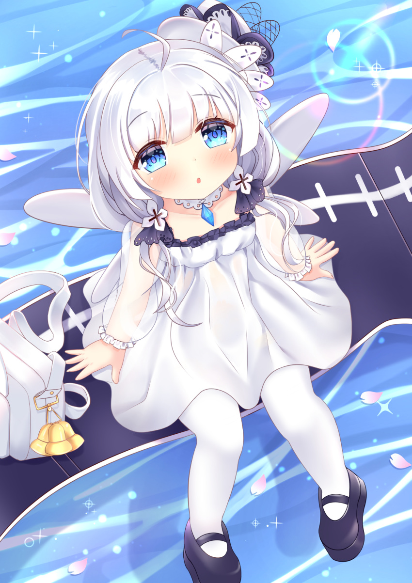1girl ahoge azur_lane bag bell black_footwear blue_eyes blush child choker dress fairy_wings fake_wings from_above hat highres hiyada_yuu jewelry little_illustrious_(azur_lane) long_hair looking_up low_twintails mary_janes open_mouth outdoors pantyhose pendant shoes short_dress silver_hair sitting solo twintails water white_dress white_headwear white_legwear wings