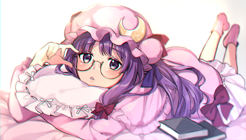 1girl bed_sheet book bow capelet crescent crescent_moon_pin dress glasses hair_bow hat highres long_hair looking_at_viewer lying mob_cap on_stomach parted_lips patchouli_knowledge pillow pink_capelet pink_dress pink_headwear pink_legwear purple_hair red_bow socks solo touhou vanilla_(miotanntann) violet_eyes