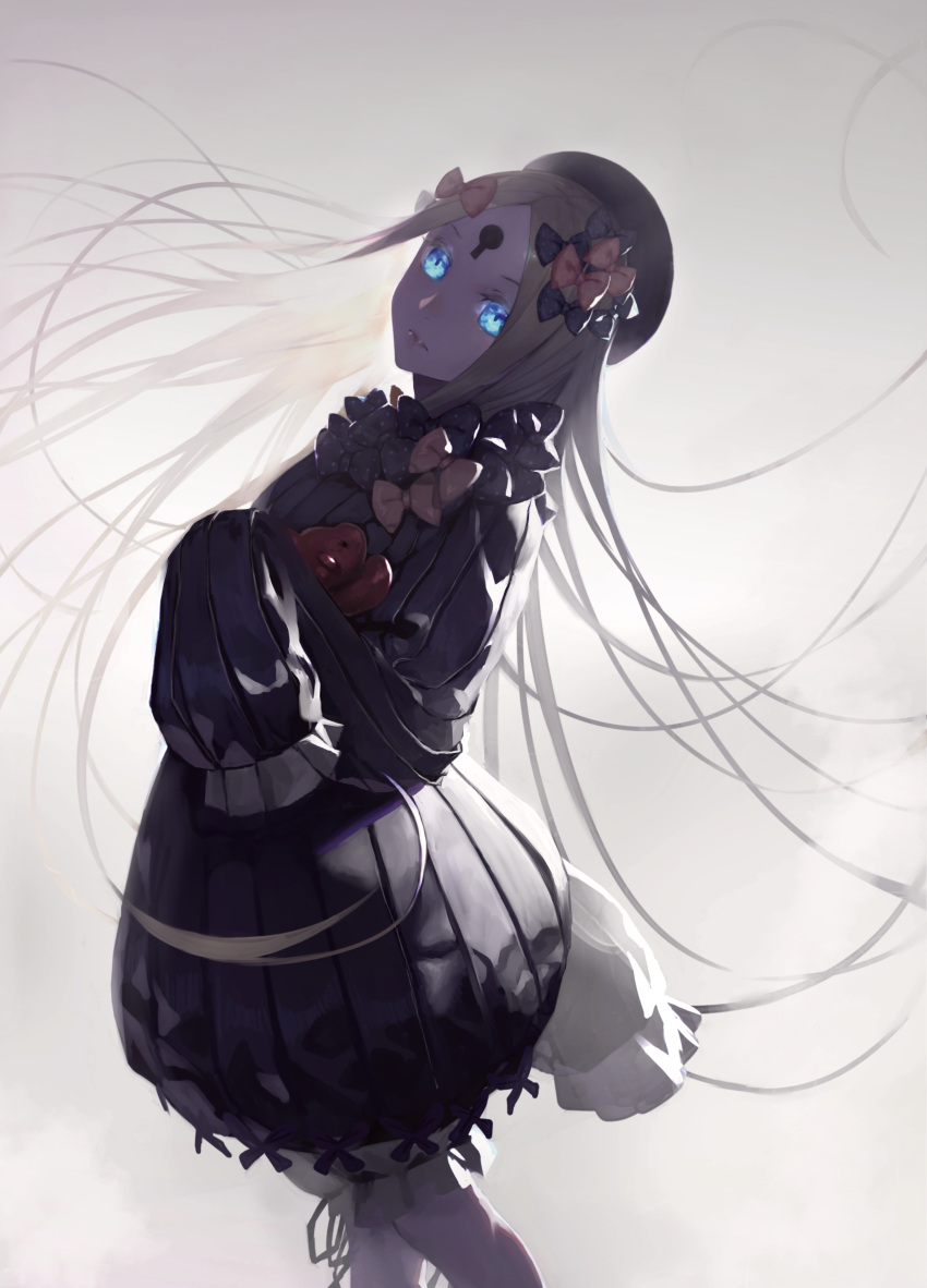 1girl abigail_williams_(fate/grand_order) absurdres bangs beret black_bow black_dress black_headwear blonde_hair blue_eyes bow dress fate/grand_order fate_(series) forehead glowing glowing_eyes hair_bow hat highres keyhole long_hair long_sleeves looking_at_viewer orange_bow parted_bangs peperon_(peperou) sleeves_past_wrists solo stuffed_animal stuffed_toy teddy_bear very_long_hair