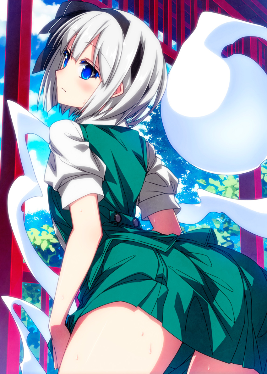 1girl ass bangs black_hairband blue_eyes blush closed_mouth colored_eyelashes commentary_request cowboy_shot day eyebrows_visible_through_hair from_behind green_skirt green_vest hairband highres hitodama konpaku_youmu konpaku_youmu_(ghost) leaning_forward looking_at_viewer looking_back outdoors sazanami_mio shirt short_hair short_sleeves silver_hair skirt solo thighs torii touhou vest white_shirt